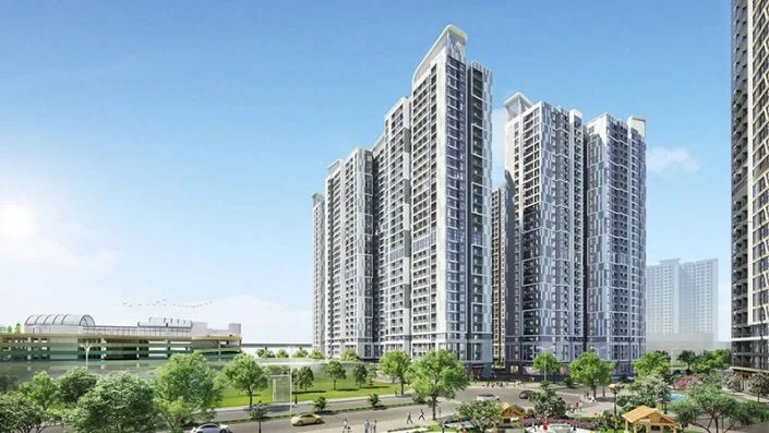 Các tòa nhà chung cư cao tầng hiện đại với kiến trúc đồng bộ, bao quanh là cây xanh và đường phố.