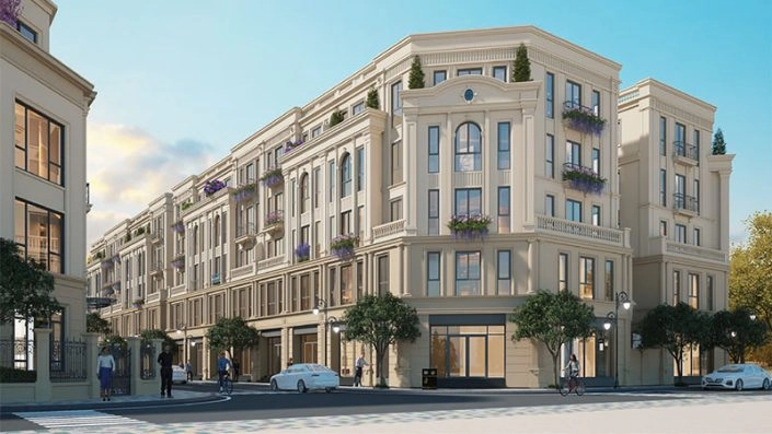 Dãy nhà phố thương mại mặt tiền rộng, kiến trúc tân cổ điển với nhiều cửa hàng và ban công trang trí.