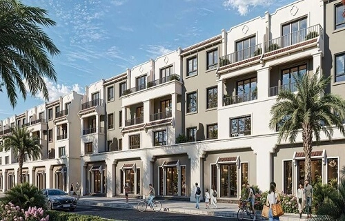 Dãy nhà phố thương mại với kiến trúc tân cổ điển, có ban công và cửa hàng ở tầng trệt, cây xanh dọc vỉa hè