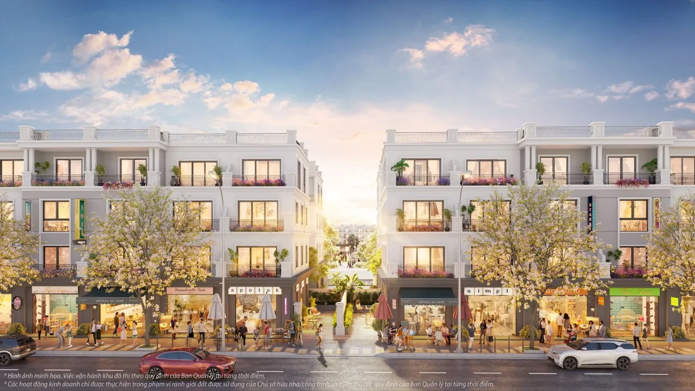 Phối cảnh dãy nhà phố thương mại hai bên đường, với kiến trúc đồng bộ và ánh sáng hoàng hôn rực rỡ