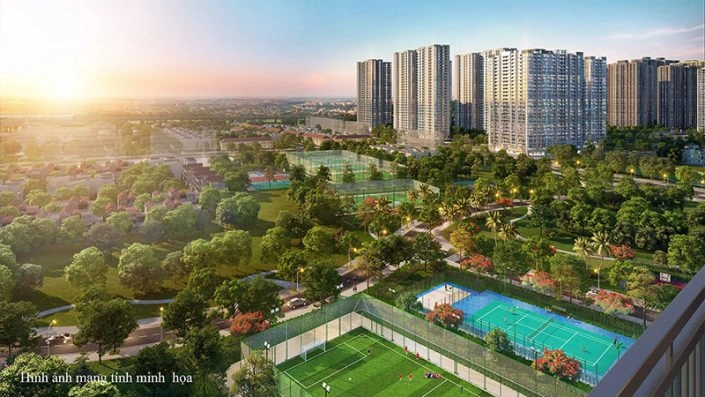 Toàn cảnh dự án khu đô thị với các tòa nhà cao tầng, sân thể thao và công viên cây xanh vào buổi hoàng hôn
