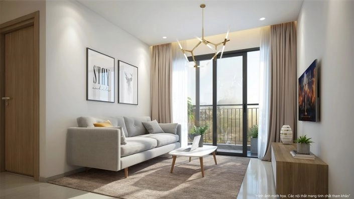 Nội thất phòng khách hiện đại với ghế sofa màu xám nhạt, bàn trà, kệ TV và cửa kính lớn dẫn ra ban công, trang trí bằng hai bức tranh treo tường.