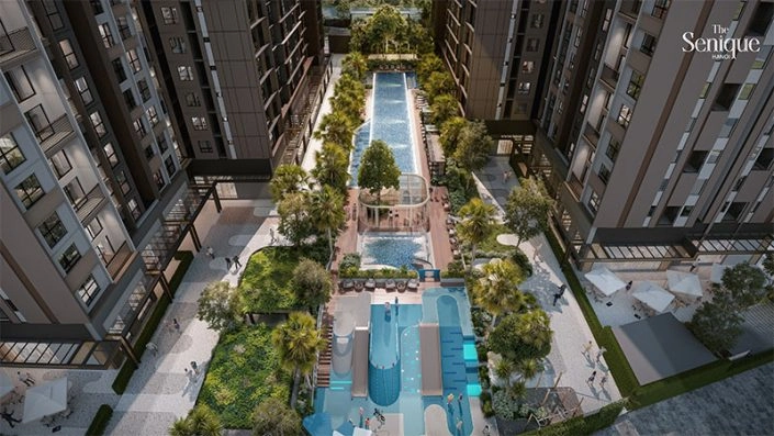 Toàn cảnh bể bơi nội khu và khu vui chơi nước cho trẻ em nằm giữa các tòa nhà cao tầng của The Senique.